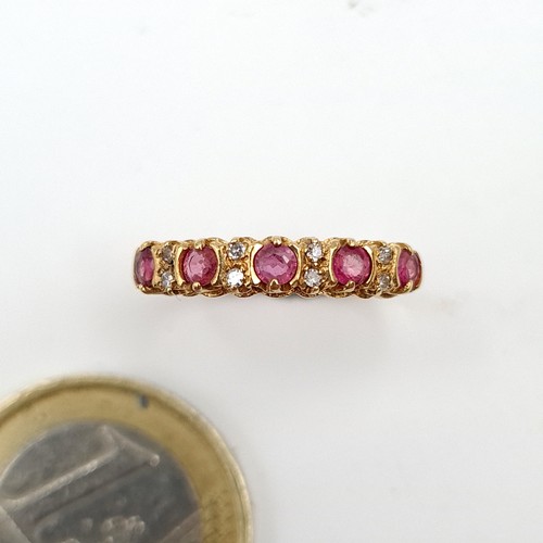 945 - Star Lot : A stunning 9ct Gold Ring set with diamonds and spinel gemstones. Weight 1.45g. Size L. Wi... 