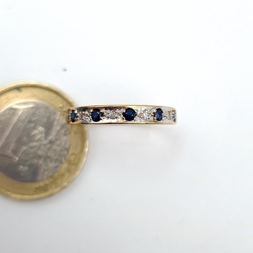 981 - Star Lot : A lovely 9 stone Sapphire and Diamond Ring, size N, weight 1.48 gms.