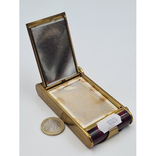 939 - A striking 20th century vanity compact comprising of a manicure set with scissors, file and cuticle ... 