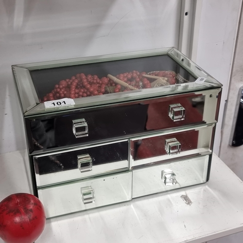 101 - A sleek mirrored jewellery box with five drawers and a large selection of what looks like good quali... 