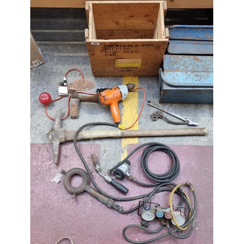 306 - A large collection of tools, including a heavy vintage pic axe, a Black and Decker 350 watt drill an... 