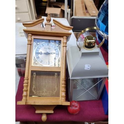 309 - A lovely example of a Daniel Dakota quartz wall clock, set with a West Minister chime and featuring ... 