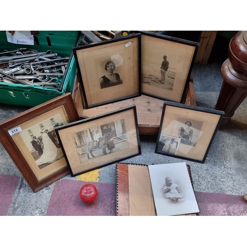 312 - A collection of five framed and mounted antique photographs, ranging from 1920's-1940's. Featuring f... 