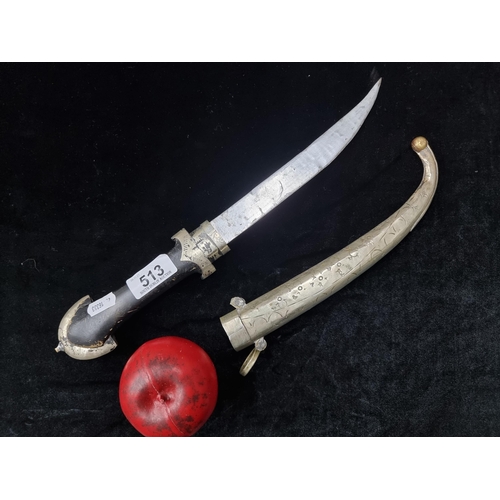 513 - A vintage Persian dagger with metal sheath.