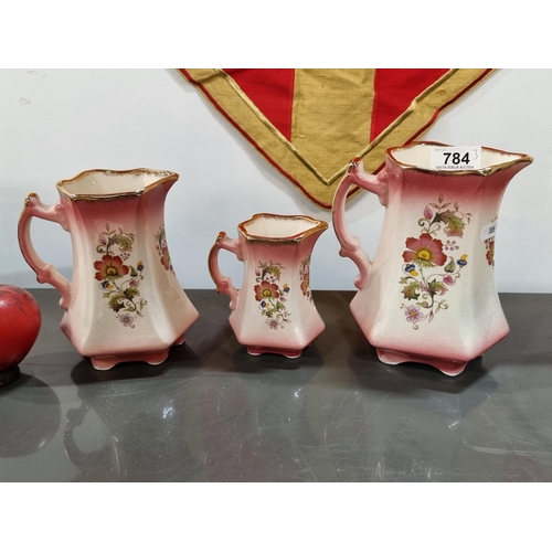 784 - A collection of three matching antique Staffordshire of England fine bone China items, each set with... 