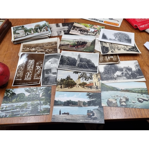 798 - A collection of roughly 50 vintage Irish postcards in black and white and colour. Some interesting s... 