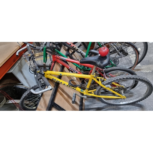 A Raleigh Avalanche bicycle with a 16 inch frame Shimano gears and yellow finish