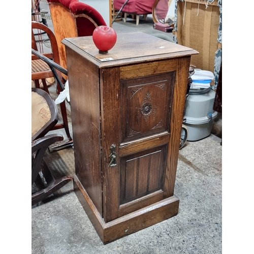 748 - A charming vintage oak pot cupboard. intricate floral carving and shelf to interior.From a very fine... 