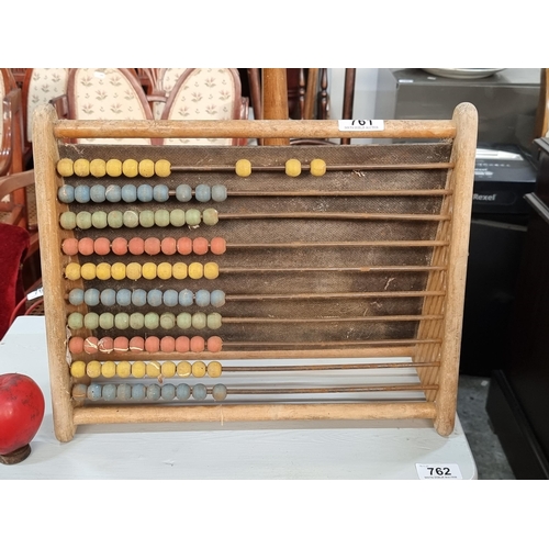 761 - A vintage school abacus with brightly coloured counters.