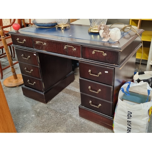 771 - Star Lot : A very handsome Victorian style desk with navy ltooled eather top, 6 drawers and a false ... 