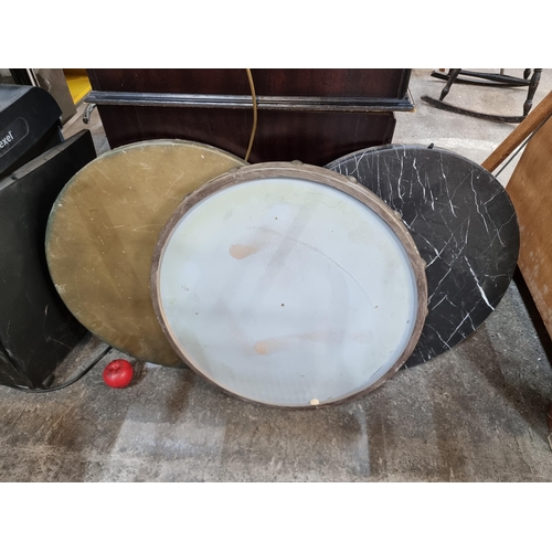 775 - Three pub table tops including one in a faux marble design and two with brass stud detail.