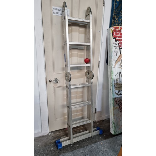 786 - A multipurpose metal folding ladder with 14 steps and six joints. Folds out to create a flat surface... 