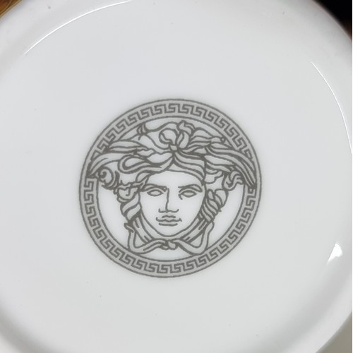 146 - Two coffee cups with wing handles and matching saucers after Versace Medusa cups. With The Medusa ba... 