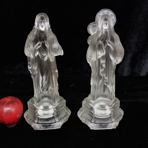 164 - A pair of frosted glass candle holders in the form of Jesus and Mary. SD to child's head. A candle f... 