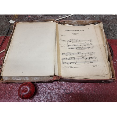 183 - A large collection of antique sheet music including Irish examples, one lot housed in a leather suit... 