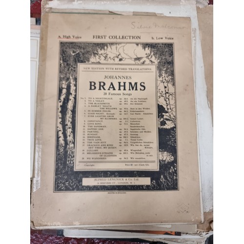 183 - A large collection of antique sheet music including Irish examples, one lot housed in a leather suit... 