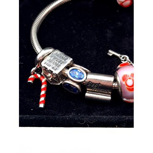 814 - A beautiful original Pandora Charm Bracelet, set with 10 charms, weight 54.53gms, contained in origi... 