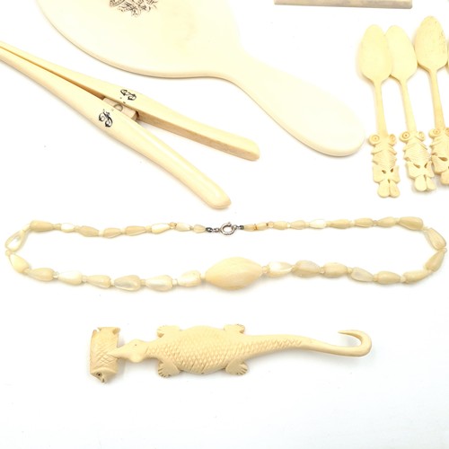 40 - A large cool collection of bone Victorian items consisting of 6 Napkin Rings, a glazed hand mirror, ... 