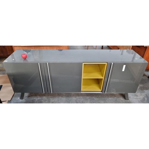 780 - Star Lot : A very large and sleek looking side board, featuring large deep storage spaces, a lacquer... 