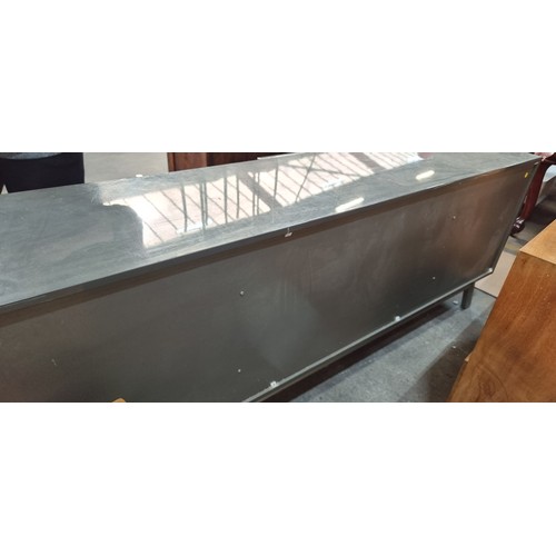 780 - Star Lot : A very large and sleek looking side board, featuring large deep storage spaces, a lacquer... 