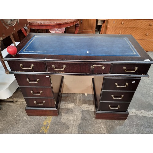 771 - Star Lot : A very handsome Victorian style desk with navy ltooled eather top, 6 drawers and a false ... 