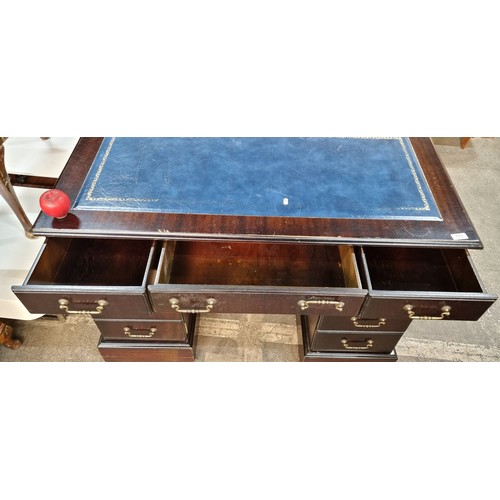 771 - Star Lot : A very handsome Victorian style desk with navy ltooled eather top, 6 drawers and a false ... 