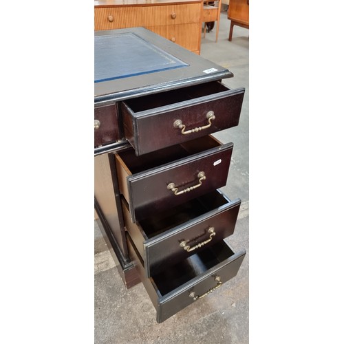 771 - Star Lot : A very handsome Victorian style desk with navy ltooled eather top, 6 drawers and a false ... 