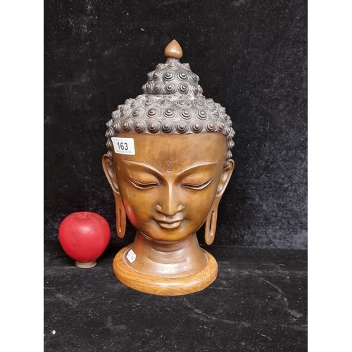 Star Lot : A fantastic heavy bronze  bust of a buddha's head, sat on a wooden base. Has good age to it. There is a video of this lot on our social media pages Facebook, Instagram and tic Tok under South Dublin Auction