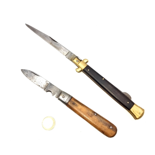 938 - Two super vintage Knives, one a stiletto style example with brass fittings, length of handle 15cm, b... 