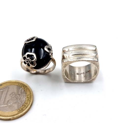 962 - Two stylish rings including a Mexican silver example in a square form (Size: K) along with a charmin... 