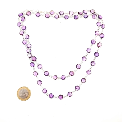 972 - A truly stunning long sterling silver necklace hallmarked '925' and set with faceted Amethyst gemsto... 