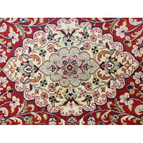 932 - Star Lot : A stunning large hand knotted Persian style woolen rug featuring a beautiful ornate geome... 