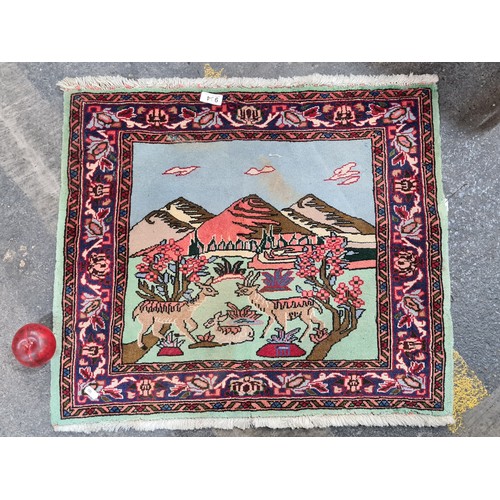 934 - Star Lot : A super sweet hand knotted woolen door mat / rug featuring a lovely mountainscape scene w... 