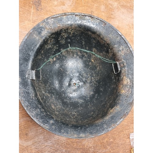 115 - An original antique WWI Doughboy steel helmet.