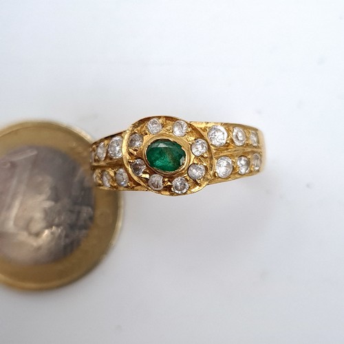 458 - An impressive gold tone dress Ring set with assorted gem stone setting. Size O, weight 4.24gms