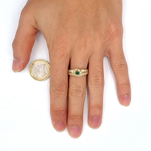 458 - An impressive gold tone dress Ring set with assorted gem stone setting. Size O, weight 4.24gms