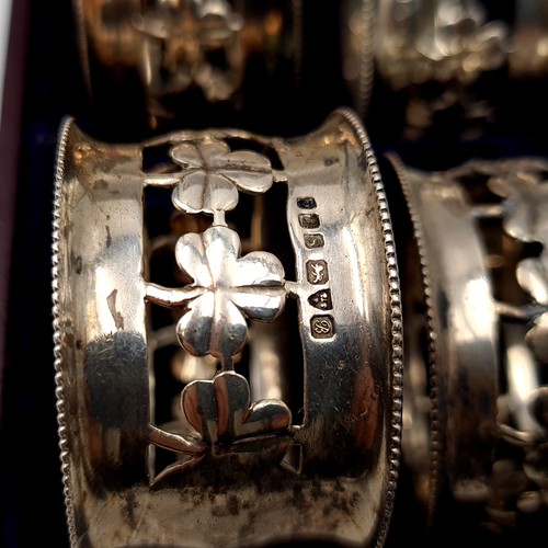 465 - A lovely set of 4 antique sterling silver Napkin Rings hallmarked Chester, c. 1917. Rings set with a... 