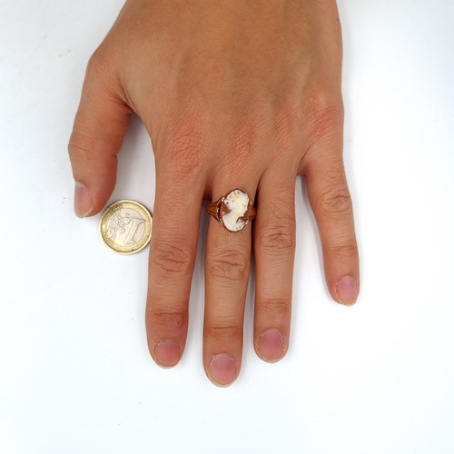 940 - A very attractive 9k gold Cameo Ring with a broad banded mount, size Q, weight 2.71gms. Boxed.