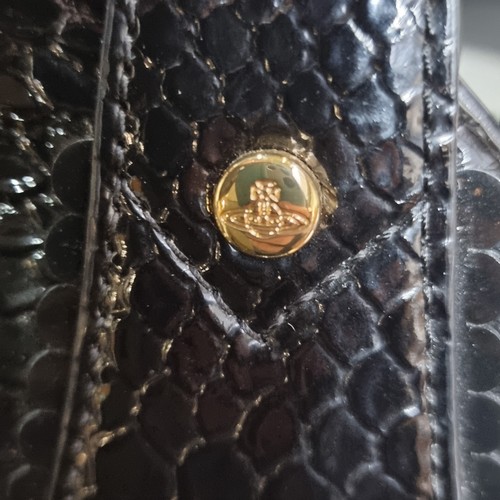 212 - Star Lot : An elegant genuine Vivienne Westwood designer handbag with a snake skin effect finish, th... 