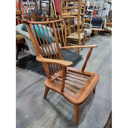 331 - A charming mid-century modern arm chair, crafted from solid teak and featuring its original vibrant ... 