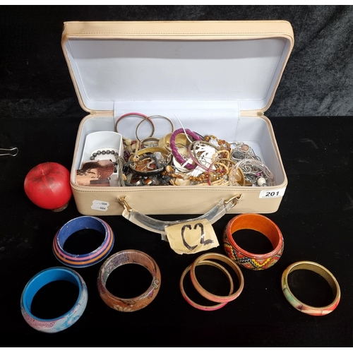 201 - A wonderful collection of costume jewelry, this lot features an array of bracelets, earrings and rin... 