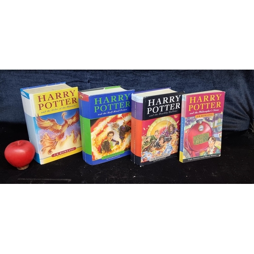 151 - A collection of 4 Harry Potter books including titles such as 