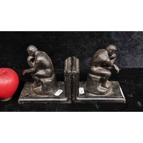 196 - Two high quality heavy cast metal bookends.