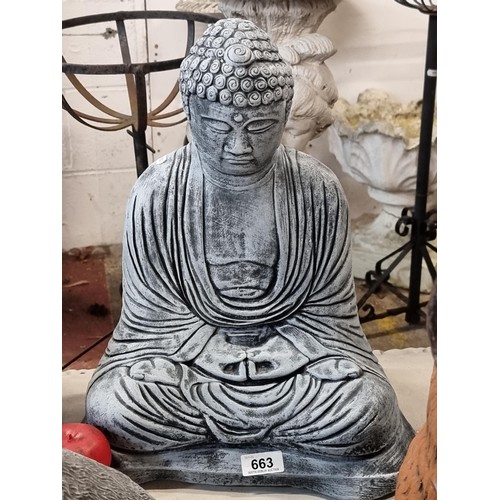 663 - A very heavy reconstituted stone garden sculpture of a meditative Buddha figure, in very good condit... 