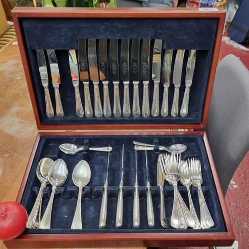 962 - A large handsome cutlery canteen containing knives, forks and serving spoons by Newbridge and Sheffi... 