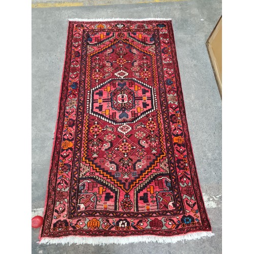 941 - Star Lot : A fabulous hand knotted Persian  woolen rug featuring a rich foliate and geometric design... 