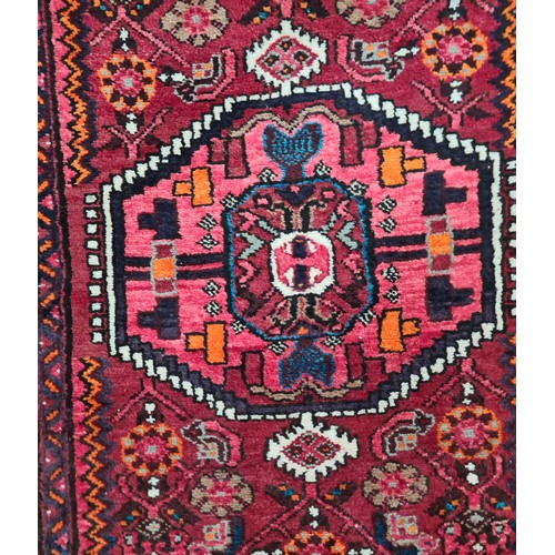 941 - Star Lot : A fabulous hand knotted Persian  woolen rug featuring a rich foliate and geometric design... 