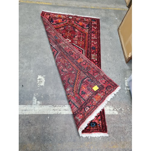 941 - Star Lot : A fabulous hand knotted Persian  woolen rug featuring a rich foliate and geometric design... 