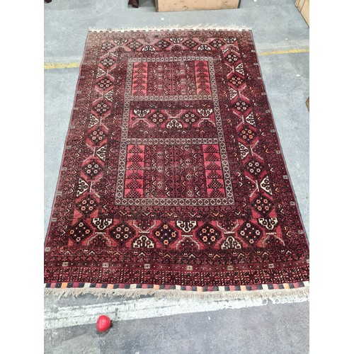 950 - Star lot : A fabulous hand knotted woolen Persian style rug with an intricate geometric pattern in w... 