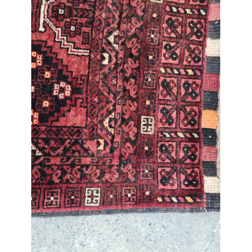 950 - Star lot : A fabulous hand knotted woolen Persian style rug with an intricate geometric pattern in w... 